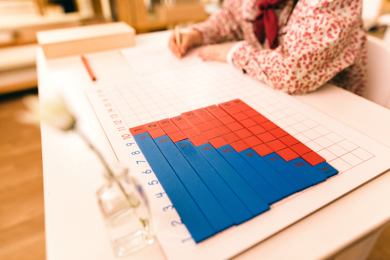 Wood montessori material, class at school with math bars
